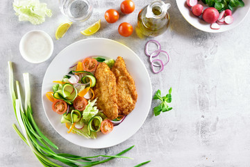 Vegetable salad and schnitzel