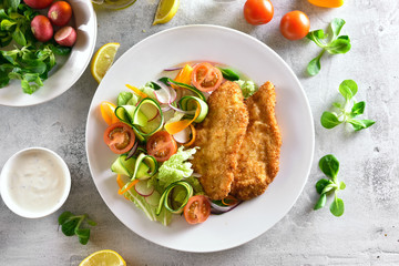 Vegetable salad and schnitzel