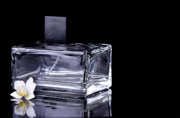 Female perfume on a black background