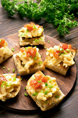 Omelet, scrambled eggs on toasted bread