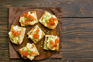 Omelet, scrambled eggs on toasted bread