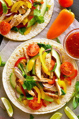 Tacos with chicken meat and vegetables
