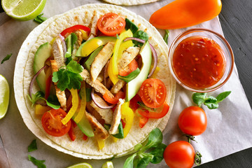 Taco with chicken meat and vegetables