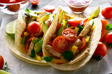 Tacos with chicken meat and vegetables