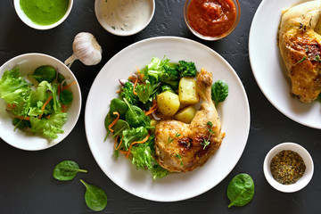  Fried chicken leg with potato and green salad