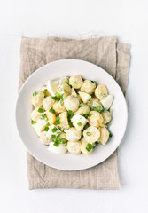 Potato salad with eggs and green onion