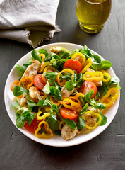Vegetable salad with pieces of chicken meat