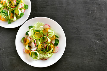 Vegetable salad from zucchini, radish, bell pepper