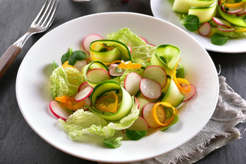 Vegetable salad from zucchini, radish, bell pepper