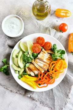 Salad with grilled chicken breast and fresh vegetables