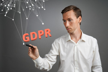 GDPR concept image. General Data Protection Regulation, the protection of personal data in European Union. Young man working with information.
