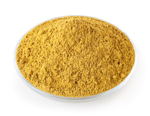 Curry powder in glass bowl isolated on white background with clipping path