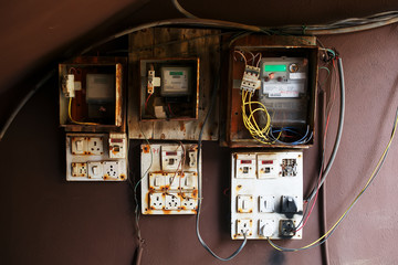 An old broken switch. Broken old shield, equipment control panel.