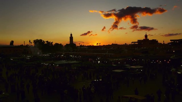 Famous Jemaa el Fna square crowded at sunset, Marrakesh, Morocco, timelapse 4k
