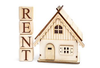 Wooden cubes with word RENT and model of house on white.