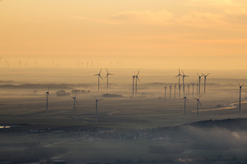 Fototapeta na wymiar Wind farm of wind turbines