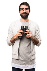 Happy Hipster man with binoculars on white background
