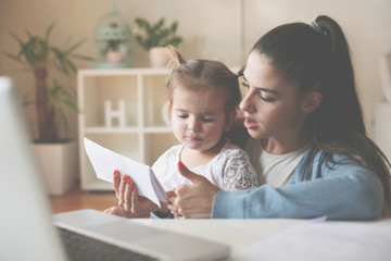 Mother and daughter at home.