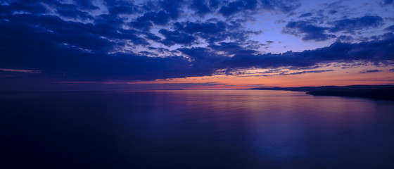 Fototapeta na wymiar Spring sunset over Jurassic coast from St Alban's of St Adhelm's Head, Dorset, UK