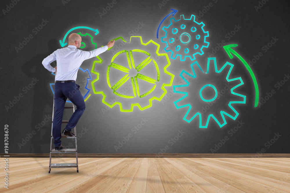 Poster businessman in front of a wall with a cogwheel interface setting with different colors - technology 
