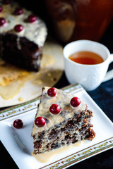 chocolate cake with cherries on a saucer