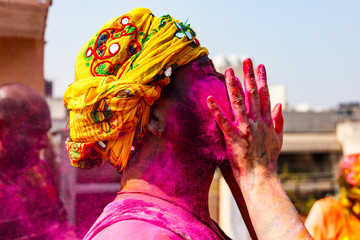 Indian with turban and colors on his face