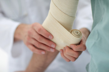 closeup.doctor applying elastic bandage