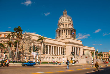 Capitolio Nacional, El Capitolio. Old classic retro cars and motorbikes are on the way. Havana. Cuba