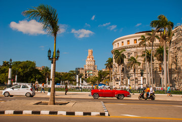Capitolio Nacional, El Capitolio. Old classic retro cars and motorbikes are on the way. Havana. Cuba