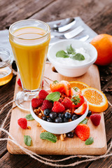 Granola with fruits and orange juice