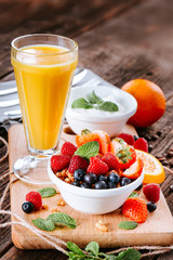 Granola with fruits and orange juice