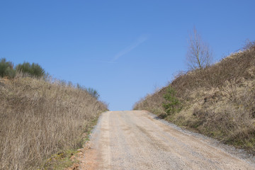 view in the sky over a dirt road