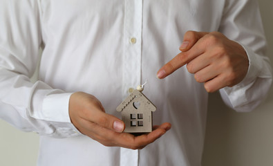 Wooden House on the green grass. Real estate and mortgage invesment.