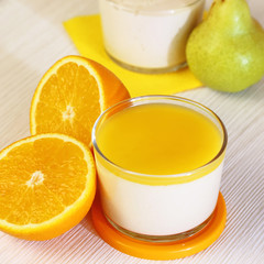 Food. Panna cotta. Italian milk citrus dessert made of yoghurt and cream with pear and orange.