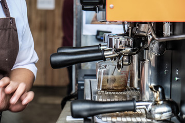 Cafe barista making coffee preparing machine
