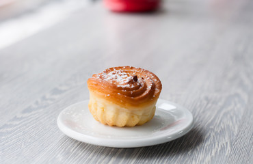 delicious cupcake for coffee, sprinkled with sugar powder