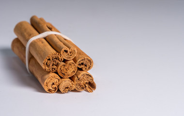 Ceylon cinnamon sticks on white background. True cinnamon.