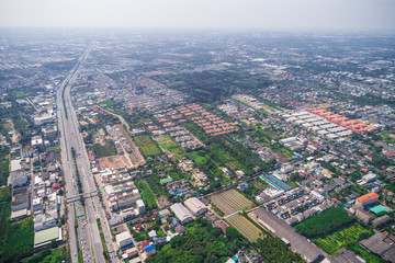 Obraz premium Aerial view of modern city traffic road with building