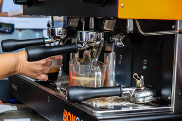 Cafe barista making coffee preparing machine