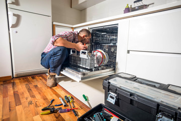 Handyman repair dishwasher in  the kitchen