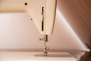 closeup of sewing machine with background
