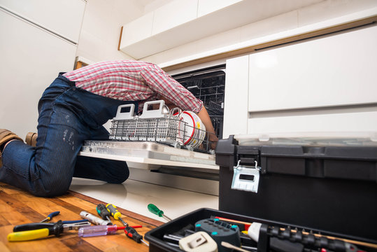 Handyman repair dishwasher in  the kitchen
