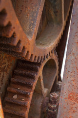close-up of particular old gears jousting with rust for children early 900