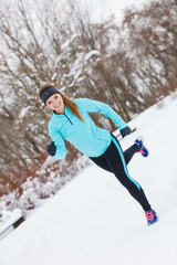 Fototapeta na wymiar Winter sport, girl exercising in park