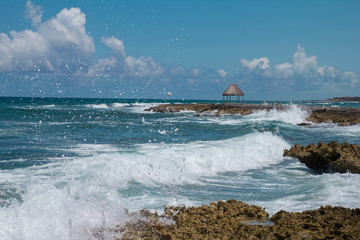 A wooden dock on the Caribbean Sea in Mexico, Yucatan. Waves