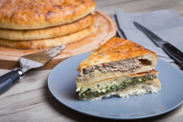 Traditional Ossetian pies. Three basic pies for the holiday. Close-up, selective focus.
