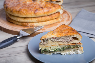Traditional Ossetian pies. Three basic pies for the holiday. Close-up, selective focus.