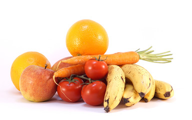 pile of bio fresh ripe oranges tomatoes apples carrots bananas