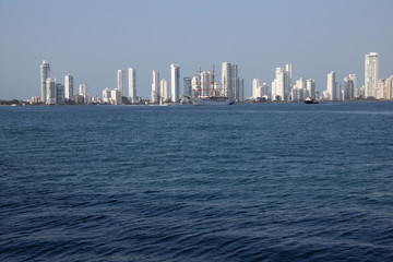 Fototapeta na wymiar Skyline of the city of Cartagena, Colombia over the Carribean ocean port entrance, South America.