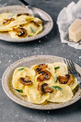 ravioli pasta with champignon mushrooms and parmesan cheese